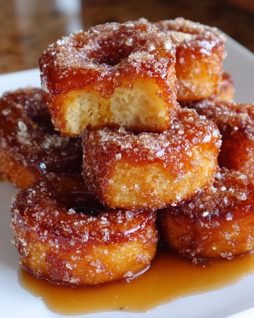 Delicious Brown Butter Maple Donut Bars on a plate, showcasing their golden glaze.
