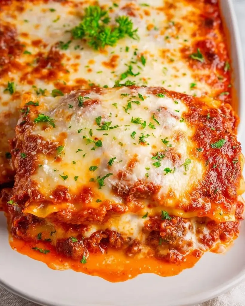 Delicious plate of homemade ravioli lasagna with layers of cheese and sauce