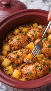 Delicious slow cooker brown sugar pineapple chicken served on a plate.