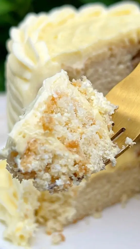 Slice of Banana Cream Cake topped with whipped cream and banana slices