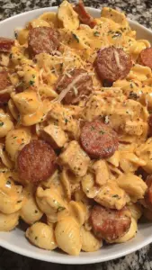 Creamy Cajun Chicken and Sausage Pasta served in a bowl with fresh herbs